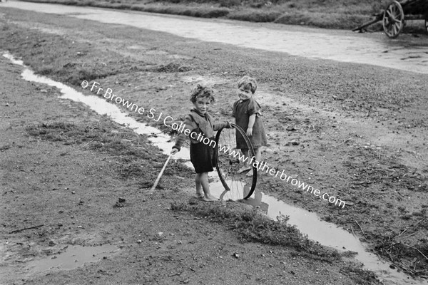 CHILDREN PLAYING IN STREET